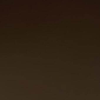 Brown gradient background with smooth texture, displaying a monochromatic palette and uniform tonal shift from dark to light brown shades.